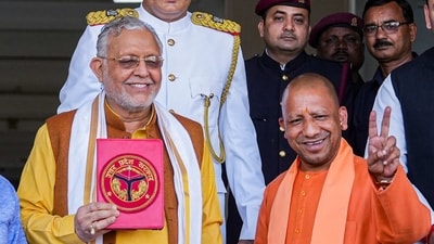Uttar Pradesh Chief Minister Yogi Adityanath with Finance Minister Suresh Kumar Khanna before presentation of the State Budget 2023-24 in the Assembly in Lucknow, Wednesday, (PTI) Uttar Pradesh Chief Minister Yogi Adityanath with Finance Minister Suresh Kumar Khanna before presentation of the State Budget 2023-24 in the Assembly in Lucknow, Wednesday, (PTI)