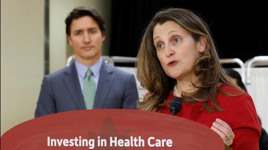 Canada's Deputy Prime Minister and Minister of Finance Chrystia Freeland (right), with Prime Minister Justin Trudeau, takes part in a news conference after touring a medical training facility in Ottawa, Ontario. (REUTERS)
