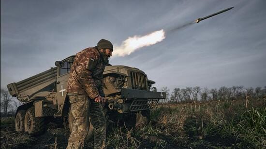 FILE - Ukrainian military's Grad multiple rocket launcher fires rockets at Russian positions in the frontline near Bakhmut, Donetsk region of Ukraine. (AP File Photo)