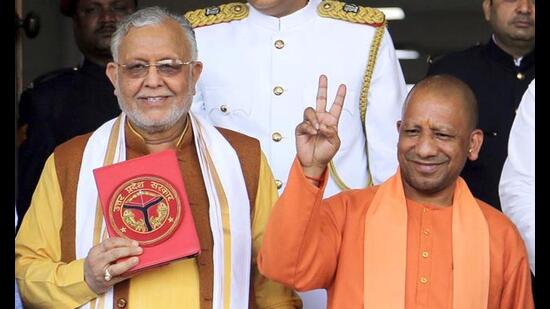 Uttar Pradesh chief minister Yogi Adityanath along with state finance minister Suresh Khanna arrives to present the budget for the financial year 2023-24 during the Budget Session of the Uttar Pradesh Assembly, in Lucknow on Wednesday. (ANI Photo)