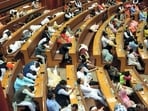 Some councillors relax while others sleep during the election of members of the standing committee at Civic Centre in New Delhi, Wednesday. (PTI)