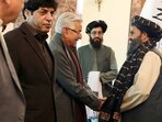 Mullah Abdul Ghani Baradar, the Taliban-appointed deputy prime minister for economic affairs, right, shakes hands with Pakistan's defense minister, Khawaja Mohammad Asif, during a meeting in Kabul on Wednesday, (AP) Mullah Abdul Ghani Baradar, the Taliban-appointed deputy prime minister for economic affairs, right, shakes hands with Pakistan's defense minister, Khawaja Mohammad Asif, during a meeting in Kabul on Wednesday, (AP)