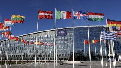 Flags flutter in the wind outside Nato headquarters in Brussels, Belgium. (AP) Flags flutter in the wind outside Nato headquarters in Brussels, Belgium. (AP)