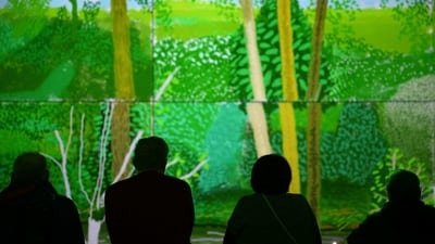  "The world is a very very beautiful if you look at it. Most people don't look," says Hockney in a commentary that runs through the show, along with archive recordings. Now aged 85 and still painting, Hockney fully embraced the immersive concept, said Richard Slaney, chief executive of London's new Lightroom venue which co-developed the show with the artist. (Daniel Leal / AFP) "The world is a very very beautiful if you look at it. Most people don't look," says Hockney in a commentary that runs through the show, along with archive recordings. Now aged 85 and still painting, Hockney fully embraced the immersive concept, said Richard Slaney, chief executive of London's new Lightroom venue which co-developed the show with the artist. (Daniel Leal / AFP)
