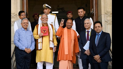 Chief minister Yogi Adityanath and state finance minister Suresh Khanna arriving to present the state Budget at Vidhan Bhawan in Lucknow. (Deepak Gupta/HT FILE)
