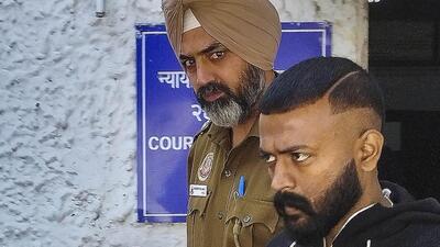 During the raid, jail officials found Gucci slippers and two expensive pairs of jeans from Chandrashekhar’s prison cell. (PTI) During the raid, jail officials found Gucci slippers and two expensive pairs of jeans from Chandrashekhar’s prison cell. (PTI)