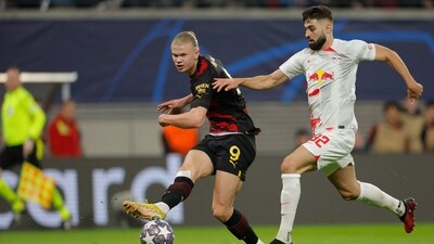 Manchester City's Norwegian striker Erling Haaland (L) gets a shot away past Leipzig's Croatian defender Josko Gvardiol during the UEFA Champions League round of 16, first-leg football match between RB Leipzig and Manchester City in Leipzig, eastern Germany on February 22, 2023. (Photo by Odd ANDERSEN / AFP) (AFP) Manchester City's Norwegian striker Erling Haaland (L) gets a shot away past Leipzig's Croatian defender Josko Gvardiol during the UEFA Champions League round of 16, first-leg football match between RB Leipzig and Manchester City in Leipzig, eastern Germany on February 22, 2023. (Photo by Odd ANDERSEN / AFP) (AFP)