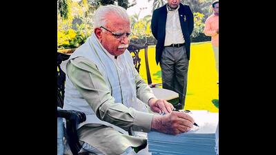 Haryana CM Manohar Lal signs copies of the State Budget 2023-24 at his residence, in Chandigarh, Thursday. (PTI) Haryana CM Manohar Lal signs copies of the State Budget 2023-24 at his residence, in Chandigarh, Thursday. (PTI)