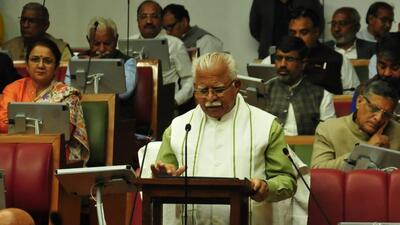 Haryana chief minister Manohar Lal Khattar, who also holds the finance portfolio, reading out the budget estimates for 2023-24 from a tablet in the assembly on Thursday. (HT Photo) Haryana chief minister Manohar Lal Khattar, who also holds the finance portfolio, reading out the budget estimates for 2023-24 from a tablet in the assembly on Thursday. (HT Photo)