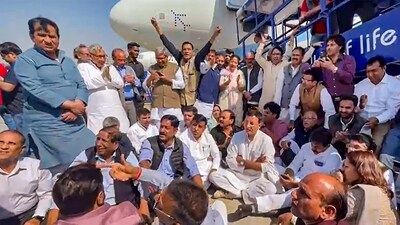 **EDS: SCREENSHOT VIA AICC** New Delhi: Congress leaders stage a protest dharna at the IGI Airport after the party leader Pawan Khera was allegedly deboarded from the plane owing to an FIR against him, in New Delhi, Thursday, Feb. 23, 2023. (PTI Photo) (PTI02_23_2023_000039B) (PTI) **EDS: SCREENSHOT VIA AICC** New Delhi: Congress leaders stage a protest dharna at the IGI Airport after the party leader Pawan Khera was allegedly deboarded from the plane owing to an FIR against him, in New Delhi, Thursday, Feb. 23, 2023. (PTI Photo) (PTI02_23_2023_000039B) (PTI)