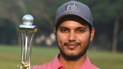 Kolkata: Indian golfer Manu Gandas holds winner trophy of 'SSP Chowrasia Invitational 2022', in Kolkata, Saturday, Dec. 17, 2022. (PTI Photo) (PTI12_17_2022_000170A) (PTI) Kolkata: Indian golfer Manu Gandas holds winner trophy of 'SSP Chowrasia Invitational 2022', in Kolkata, Saturday, Dec. 17, 2022. (PTI Photo) (PTI12_17_2022_000170A) (PTI)