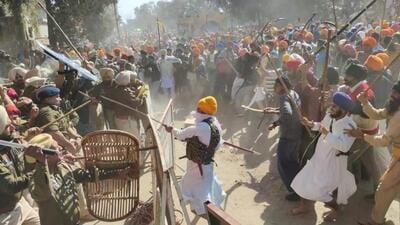 Supporters of Waris Punjab De chief Amritpal Singh clashing with Punjab Police personnel on Thursday afternoon as they headed for the police station in Ajnala to protest the arrest of his aide in a kidnap and assault case. (Sameer Sehgal/HT) Supporters of Waris Punjab De chief Amritpal Singh clashing with Punjab Police personnel on Thursday afternoon as they headed for the police station in Ajnala to protest the arrest of his aide in a kidnap and assault case. (Sameer Sehgal/HT)