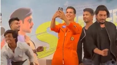 Akshay Kumar clicking selfies at an event. Akshay Kumar clicking selfies at an event.