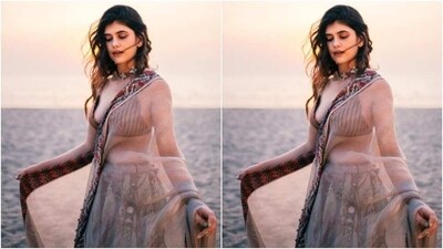 Sanjana decked up in a stripped maroon slip blouse with a plunging neckline and teamed it with a contrasting flowy skirt featuring pastel blue georgette pleats and decorations in minimal embroidery work in maroon threads. (Instagram/@sanjanasanghi96) Sanjana decked up in a stripped maroon slip blouse with a plunging neckline and teamed it with a contrasting flowy skirt featuring pastel blue georgette pleats and decorations in minimal embroidery work in maroon threads. (Instagram/@sanjanasanghi96)