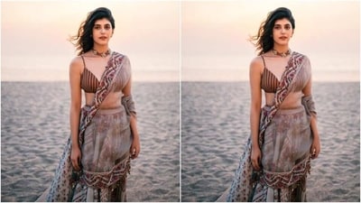 In a maroon neck choker embedded with emerald stones, Sanjana further accessorised her look for the day. (Instagram/@sanjanasanghi96) In a maroon neck choker embedded with emerald stones, Sanjana further accessorised her look for the day. (Instagram/@sanjanasanghi96)