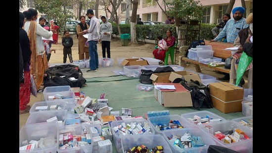 In the name of public service, NGOs were distributing medicines illegally inside Ludhiana civil hospital on Thursday. (HT Photo)