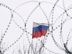 The Russian flag is seen through barbed wire as it flies on the roof of the Russian embassy in Kyiv, Ukraine. (Representational image)