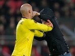 A PSV supporter punches Sevilla's goalkeeper Marko Dmitrovic in the face during the Europa League playoff second leg soccer match between PSV and Sevilla at the Philips stadium in Eindhoven, Netherlands, Thursday, Feb. 23, 2023. Sevilla won 3-2 on aggregate. (AP Photo/Peter Dejong) A PSV supporter punches Sevilla's goalkeeper Marko Dmitrovic in the face during the Europa League playoff second leg soccer match between PSV and Sevilla at the Philips stadium in Eindhoven, Netherlands, Thursday, Feb. 23, 2023. Sevilla won 3-2 on aggregate. (AP Photo/Peter Dejong)
