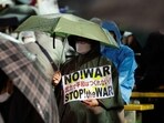 A protester attends a rally against Russia's invasion of Ukraine, on the day to mark the first anniversary of the Ukraine War, in Tokyo, Japan.