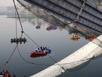 Rescue operation after the collapse of a suspension bridge over the Machchhu river in Morbi district in October, 2022. (PTI)