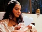 Sonam Kapoor and her son Vayu from their Diwali 2022 party.
