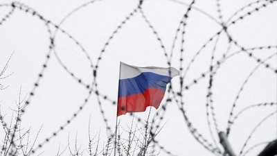 The Russian flag is seen through barbed wire as it flies on the roof of the Russian embassy in Kyiv, Ukraine. (Representational image) (REUTERS)