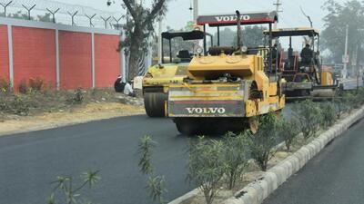 Gurugram, India- February 24, 2023: Road repairing work going on at Farukhnagar road due to G20 summit at Basai village near Railway-over-bridge, in Gurugram, India, on Friday, 24 February 2023. (Photo by Parveen Kumar/Hindustan Times)(Pic to go with Leena Dhankar's story)
