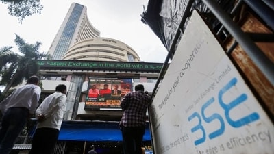 People stand outside the Bombay Stock Exchange (BSE). (REUTERS)
