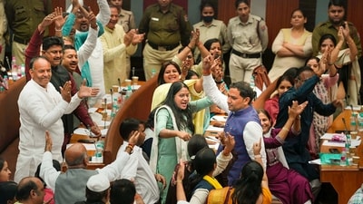 Councillor Pawan Sehrawat, who joined BJP leaving AAP, being welcomed by BJP councillors during the election of members of the Municipal Corporation of Delhi (MCD) Standing Committee, at the Civic Centre in New Delhi, Friday. (PTI) Councillor Pawan Sehrawat, who joined BJP leaving AAP, being welcomed by BJP councillors during the election of members of the Municipal Corporation of Delhi (MCD) Standing Committee, at the Civic Centre in New Delhi, Friday. (PTI)