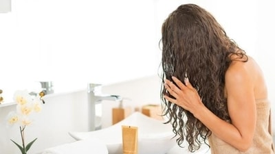 Avoid detangling when hair is wet: Wet hair is more fragile and prone to breakage, so wait until your hair is mostly dry before detangling. (Shutterstock)