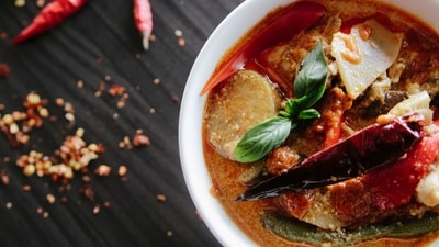 Spicy or acidic foods: Spicy or acidic foods can irritate the wound and cause pain and discomfort.&nbsp; (Unsplash)