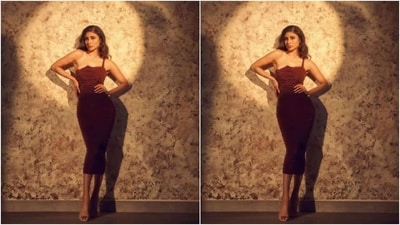 Mouni decked up in a maroon bodycon dress featuring one shoulder detail, corset patterns, and ruched details throughout the length of the dress. (Instagram/@imouniroy) Mouni decked up in a maroon bodycon dress featuring one shoulder detail, corset patterns, and ruched details throughout the length of the dress. (Instagram/@imouniroy)