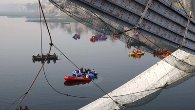 Rescue operation after the collapse of a suspension bridge over the Machchhu river in Morbi district in October, 2022. (PTI) Rescue operation after the collapse of a suspension bridge over the Machchhu river in Morbi district in October, 2022. (PTI)