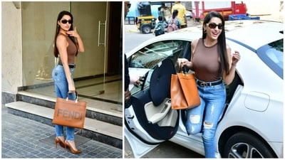 Nora Fatehi was spotted at Santa Cruz in Mumbai on Friday. She looked stunning in a brown top and distressed denims paired with matching heels and handbag. (Varinder Chawla) Nora Fatehi was spotted at Santa Cruz in Mumbai on Friday. She looked stunning in a brown top and distressed denims paired with matching heels and handbag. (Varinder Chawla)