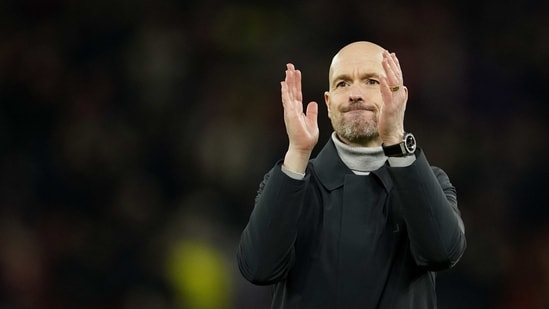 Manchester United's head coach Erik ten Hag applauds fans at the end of the Europa League playoff second leg soccer match between Manchester United and Barcelona at Old Trafford stadium in Manchester, England, Thursday, Feb. 23, 2023. Manchester United won 2-1. (AP Photo/Dave Thompson) (AP)