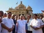 Former Karnataka chief minister B.S. Yediyurappa flashes victory sign after attending the last day of the Karnataka Assembly Session, in Bengaluru on Friday. (PTI Photo)