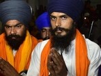Radical Sikh leader and Waris Punjab De chief Amritpal Singh (right) along with his aide Lovepreet Singh at Golden Temple on Friday night. (Sameer Sehgal/HT)