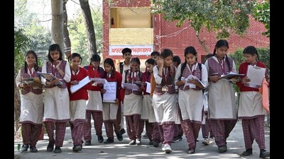 Class 8 students discussing social science paper after PSEB board exam in Ludhiana on Saturday. (Gurpreet Singh/HT)
