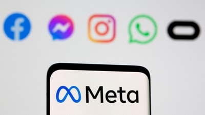 The Meta logo on smartphone in front of logo of Facebook, Messenger, Instagram, WhatsApp, Oculus in this illustration picture. (REUTERS)