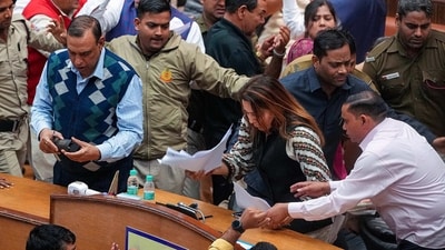 Mayor Shelly Oberoi prepares to leave amid clashes between councillors of AAP and BJP during the election of members of the MCD Standing Committee, at the Civic Centre in New Delhi on Friday, (PTI) Mayor Shelly Oberoi prepares to leave amid clashes between councillors of AAP and BJP during the election of members of the MCD Standing Committee, at the Civic Centre in New Delhi on Friday, (PTI)