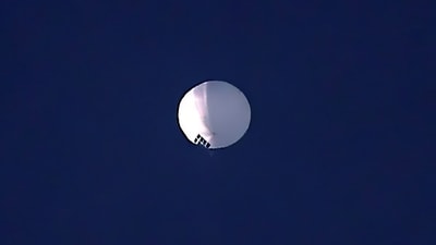 The huge, high-altitude Chinese balloon sailed across the U.S. on Friday, drawing severe Pentagon accusations of spying and sending excited or alarmed Americans outside with binoculars. (AP) The huge, high-altitude Chinese balloon sailed across the U.S. on Friday, drawing severe Pentagon accusations of spying and sending excited or alarmed Americans outside with binoculars. (AP)