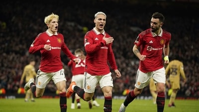 Manchester United's Antony, center, celebrates after scoring his side's second goal during the Europa League playoff second leg soccer match between Manchester United and Barcelona at Old Trafford stadium in Manchester, England, Thursday, Feb. 23, 2023. (AP Photo/Dave Thompson) (AP) Manchester United's Antony, center, celebrates after scoring his side's second goal during the Europa League playoff second leg soccer match between Manchester United and Barcelona at Old Trafford stadium in Manchester, England, Thursday, Feb. 23, 2023. (AP Photo/Dave Thompson) (AP)