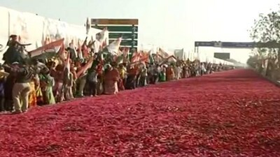 Screengrab of video shows flower petals arranged on the road for the grand welcome of the leaders. (ANI)
