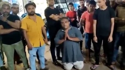 Screengrab of the video in which the shopkeeper is being made to apologise for his comment in a viral video. (Twitter)