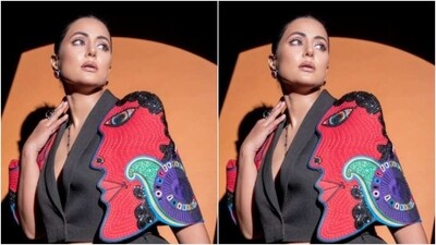 Hina picked a black cropped blazer with lapel collars and a plunging neckline. The sleeves of the blazer stole the show and for all the right reasons. Hina's blazer’s sleeves featured quirky patterns in shades of red, black and blue. (Instagram/@realhinakhan) Hina picked a black cropped blazer with lapel collars and a plunging neckline. The sleeves of the blazer stole the show and for all the right reasons. Hina's blazer’s sleeves featured quirky patterns in shades of red, black and blue. (Instagram/@realhinakhan)