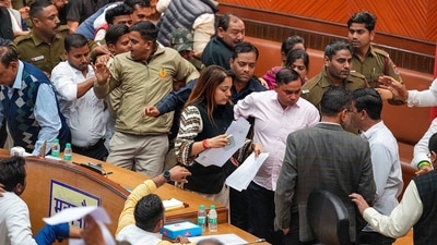 Delhi Mayor Shelly Oberoi leaves amid clashes between councillors of AAP and BJP during the election of members of the MCD Standing Committee, at the Civic Centre in New Delhi, Friday. (PTI) Delhi Mayor Shelly Oberoi leaves amid clashes between councillors of AAP and BJP during the election of members of the MCD Standing Committee, at the Civic Centre in New Delhi, Friday. (PTI)