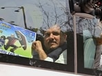 AAP MP Sanjay Singh shows a placard after being detained during a protest near CBI headquarters over Delhi Deputy Chief Minister Manish Sisodia being questioned, in New Delhi on Sunday. AAP MP Sanjay Singh shows a placard after being detained during a protest near CBI headquarters over Delhi Deputy Chief Minister Manish Sisodia being questioned, in New Delhi on Sunday.