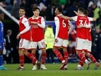 Arsenal's William Saliba, Takehiro Tomiyasu, and Gabriel celebrate after the match