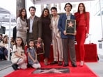 The Jonas Brothers pose with their family during their star unveiling ceremony on The Hollywood Walk of Fame in Los Angeles, California, U.S., January 30, 2023. REUTERS/Mario Anzuoni