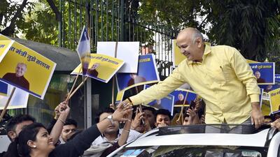 Deputy chief minister Manish Sisodia during a roadshow from his Mathura Road residence to Raj Ghat en route the CBI office for his questioning in the liquor policy case on Sunday. (Sanjeev Verma/HT Photo)